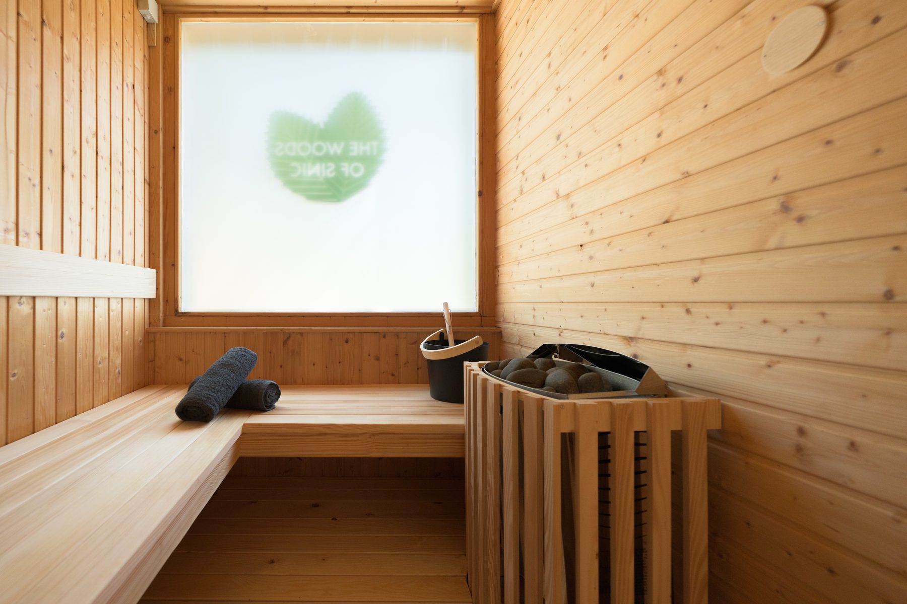Interior of a Finnish sauna with warm wood walls
