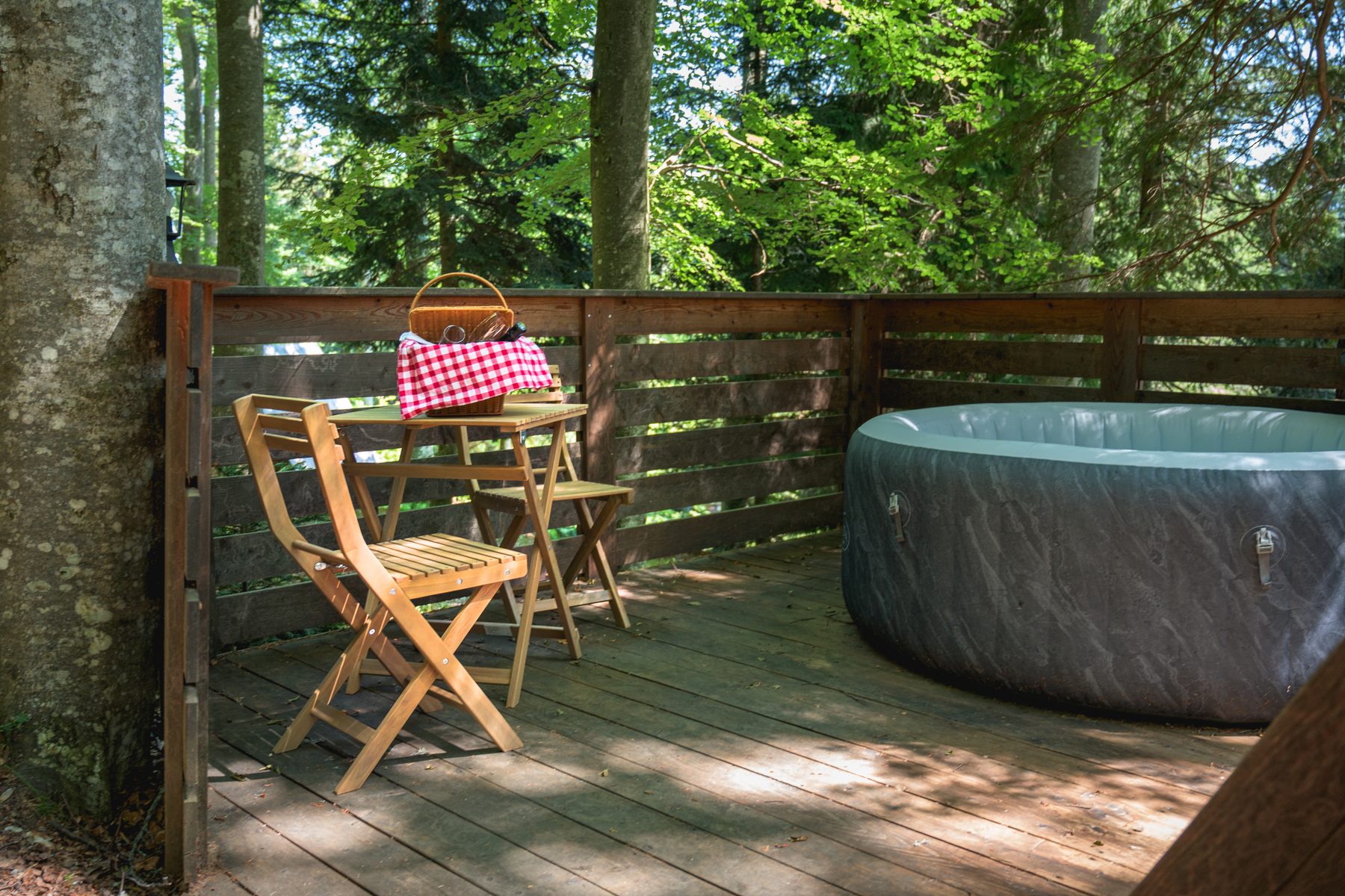 Cabin 1 — private terrace facing the forest